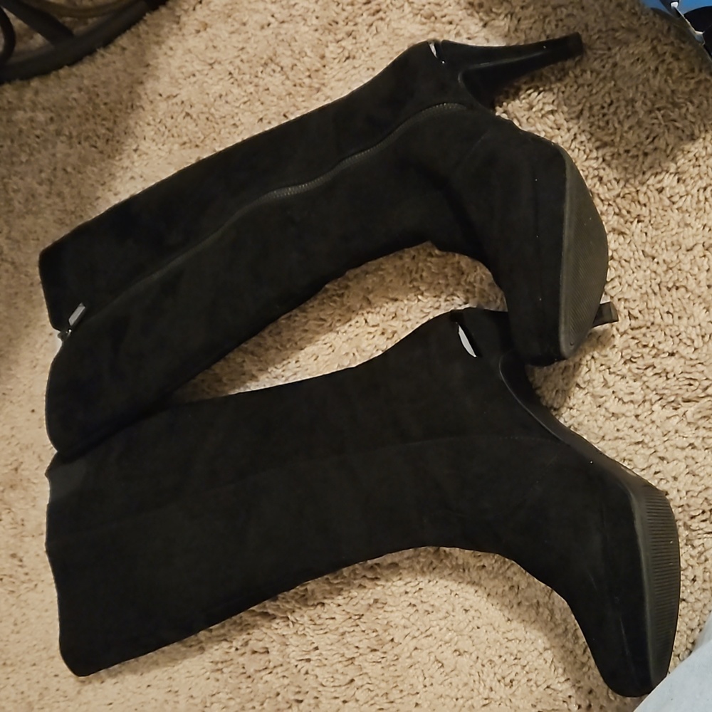 Under the knee heeled boots